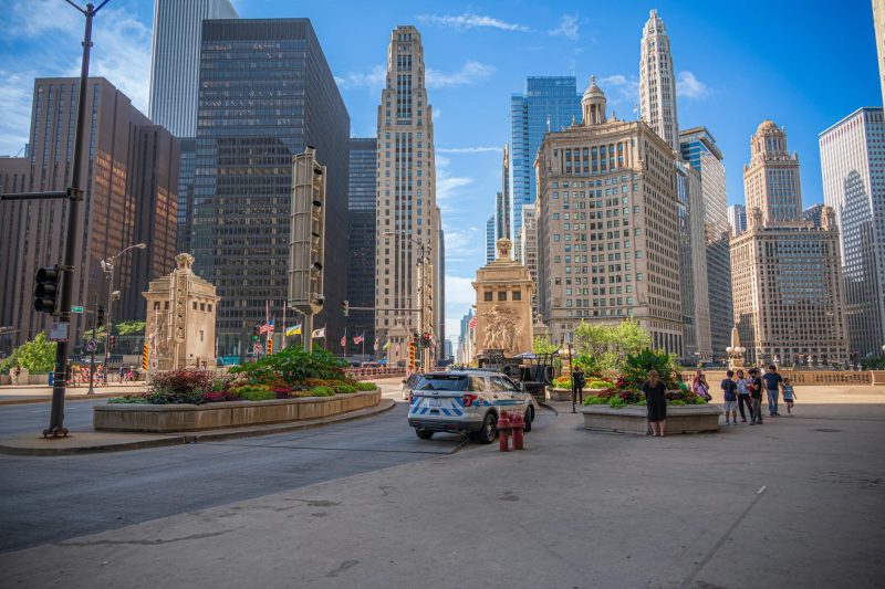 Bustling downtown Chicago with vibrant city life, featuring iconic skyscrapers and busy streets.