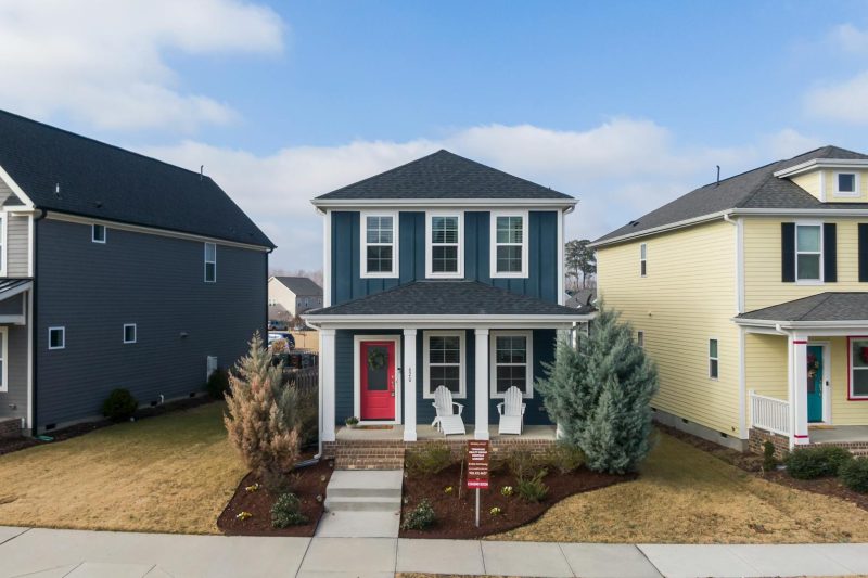 Aerial view of attractive suburban homes with modern architecture in a residential neighborhood.